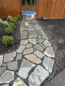 Flagstone walkway in seattle backyard